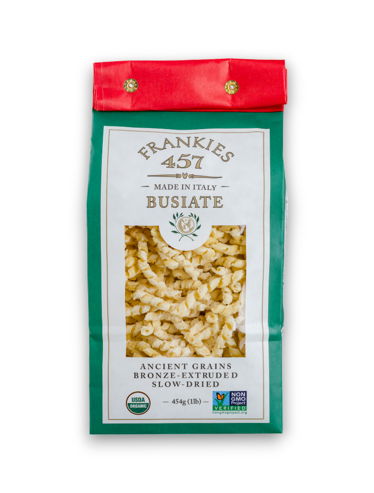 A package of Frankies 457 Busiate pasta, with a green and red design on the packaging.